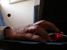 Senior citizen using a computer